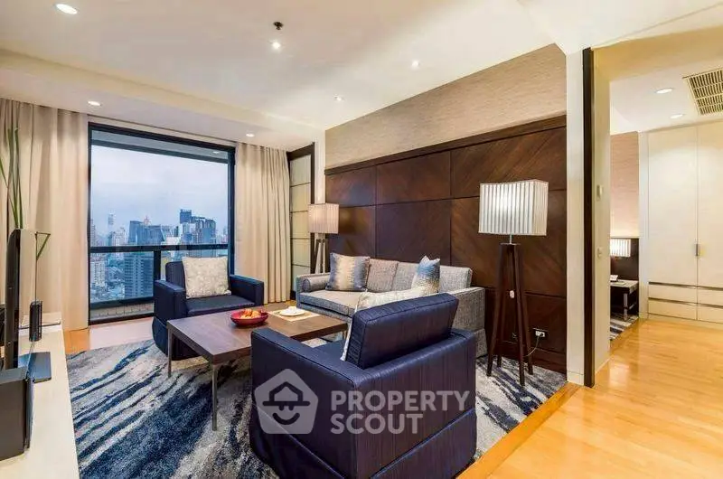 Luxurious living room with city view, modern furniture, and elegant decor.