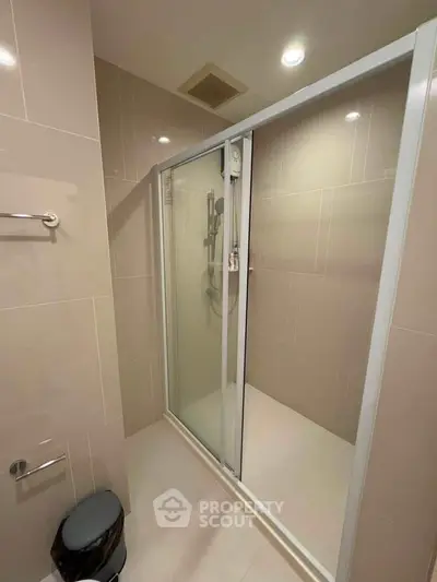 Modern bathroom with sleek shower enclosure and elegant tile design