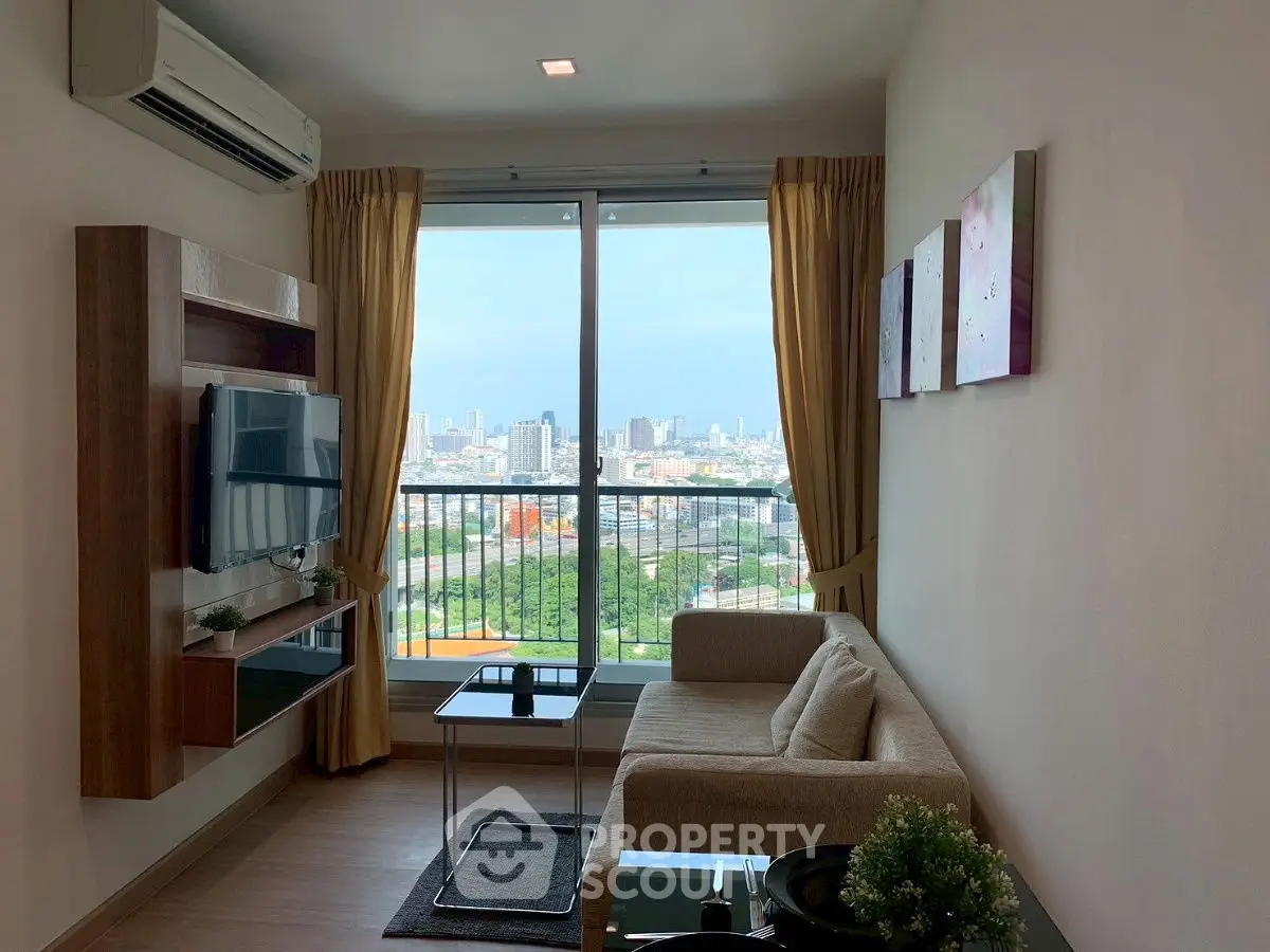 Modern living room with city view, featuring sleek furniture and large window.