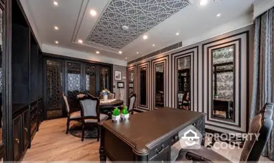 Luxurious study room with elegant decor and intricate ceiling design