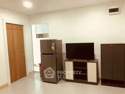 Modern living room with sleek furniture and appliances