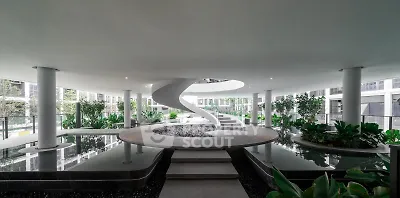 Stunning modern building interior with spiral staircase and lush greenery