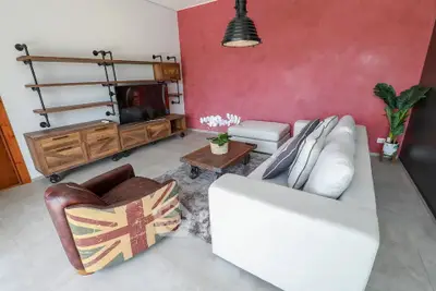 Stylish living room with modern furniture and unique decor in a cozy setting.