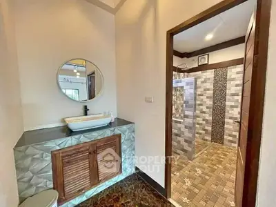 Stylish bathroom with modern sink and tiled shower area