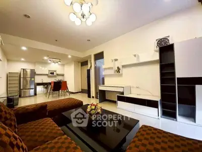 Spacious modern living room with open kitchen and stylish decor