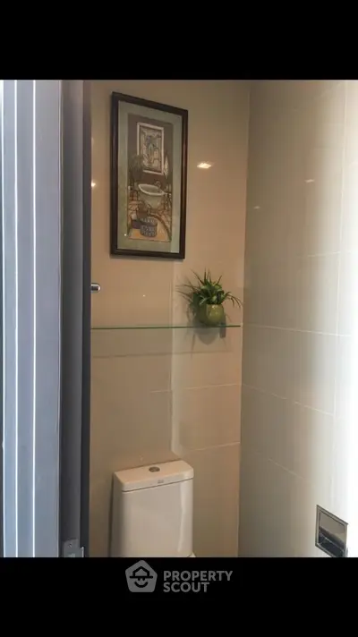 Modern bathroom with sleek toilet and stylish decor