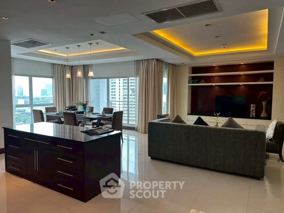 Luxurious open-plan living room with city view and modern furnishings.