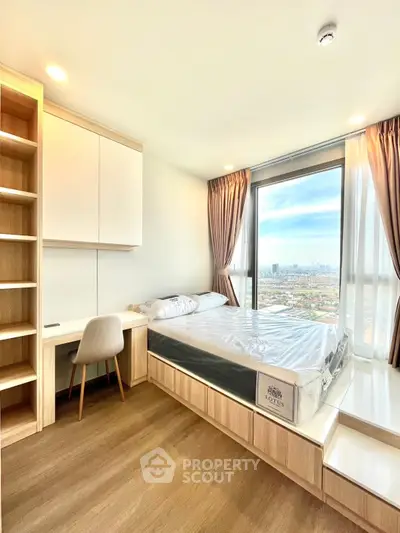 Modern bedroom with stunning city view and built-in desk