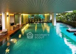 Luxurious indoor pool with modern design and ambient lighting
