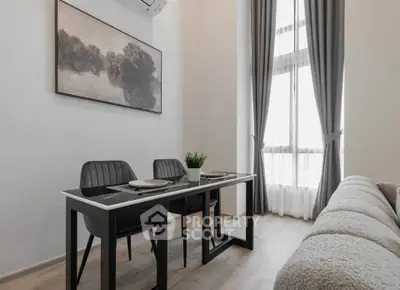 Modern living room with elegant dining area and large window