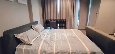 Modern bedroom with stylish decor and comfortable bed in a cozy apartment.