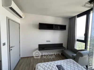 Modern bedroom with air conditioning and large windows offering a scenic view.