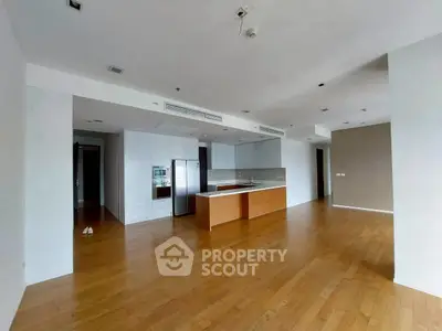 Spacious modern kitchen with open layout and wooden flooring