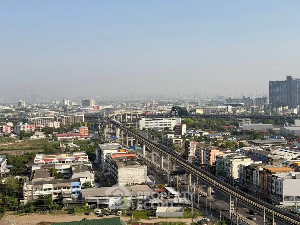 Stunning cityscape view with elevated train tracks and urban skyline, perfect for real estate investment.