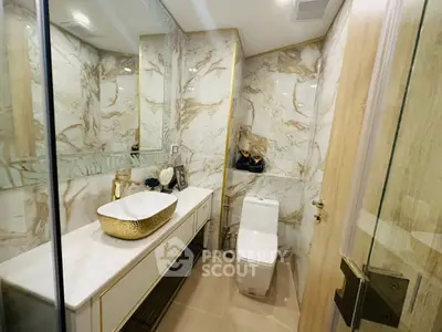 Luxurious marble bathroom with elegant gold accents and modern fixtures