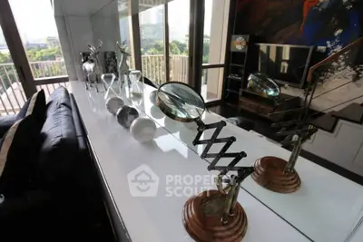 Stylish living room with modern decor and expansive balcony view