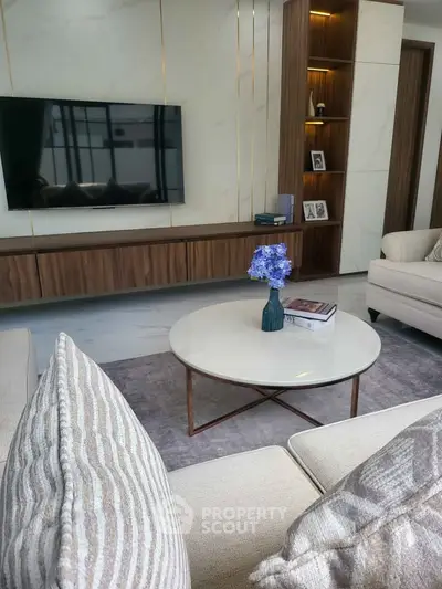 Elegant living room with modern decor and cozy seating area