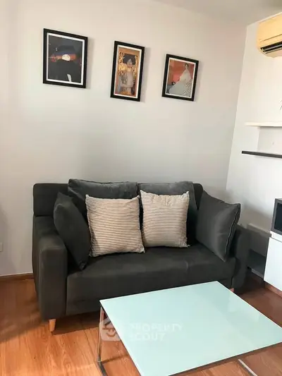 Cozy living room with modern sofa and stylish decor in a contemporary apartment.