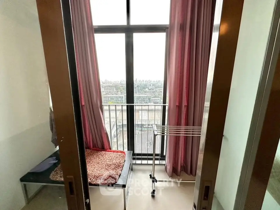 Cozy balcony with city view, perfect for relaxation and enjoying the skyline.