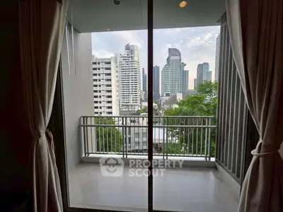 Modern apartment balcony with city skyline view, perfect for urban living.