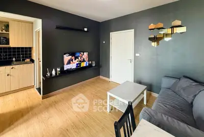 Modern living room with sleek design and open kitchen layout