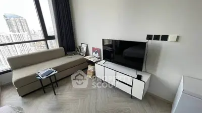 Modern living room with city view, sleek furniture, and natural light.