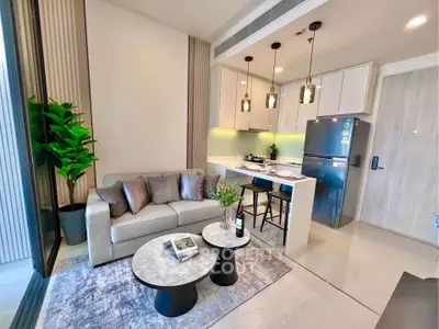 Modern open-layout living room with stylish kitchen and cozy seating area