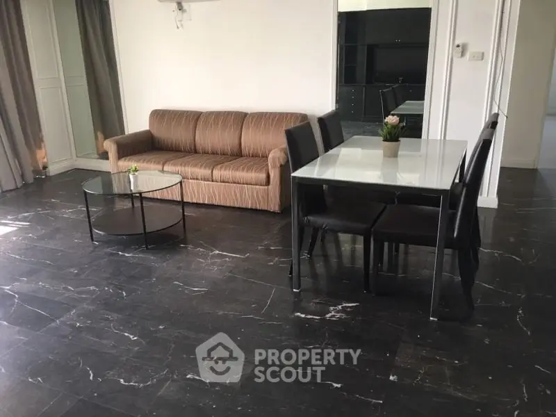 Spacious living room with modern furniture and elegant marble flooring