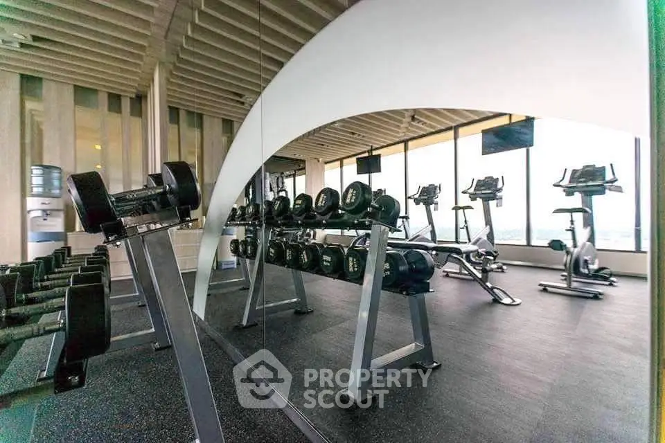 Modern gym with state-of-the-art equipment and panoramic city views
