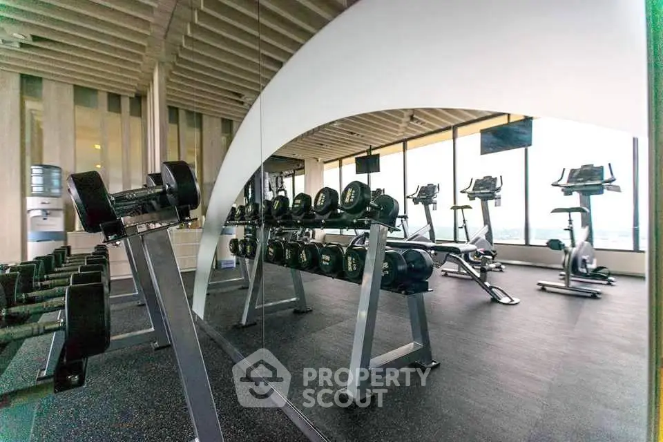 Modern gym with state-of-the-art equipment and panoramic windows.