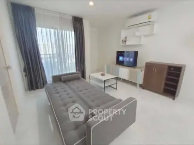 Modern living room with stylish sofa and entertainment center