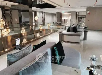 Luxurious modern living room with elegant decor and plush seating in a high-end property.