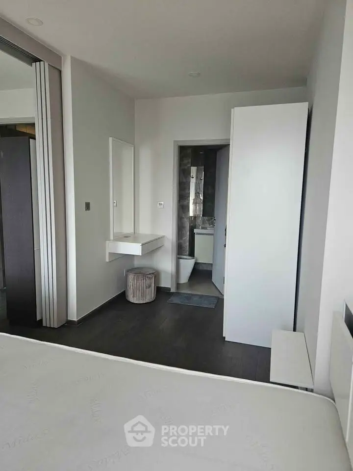 Modern bedroom with ensuite bathroom and sleek minimalist design