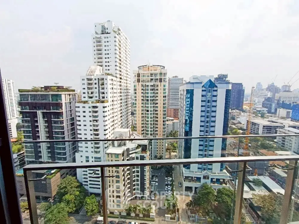 Stunning cityscape view from a high-rise balcony showcasing modern urban living.