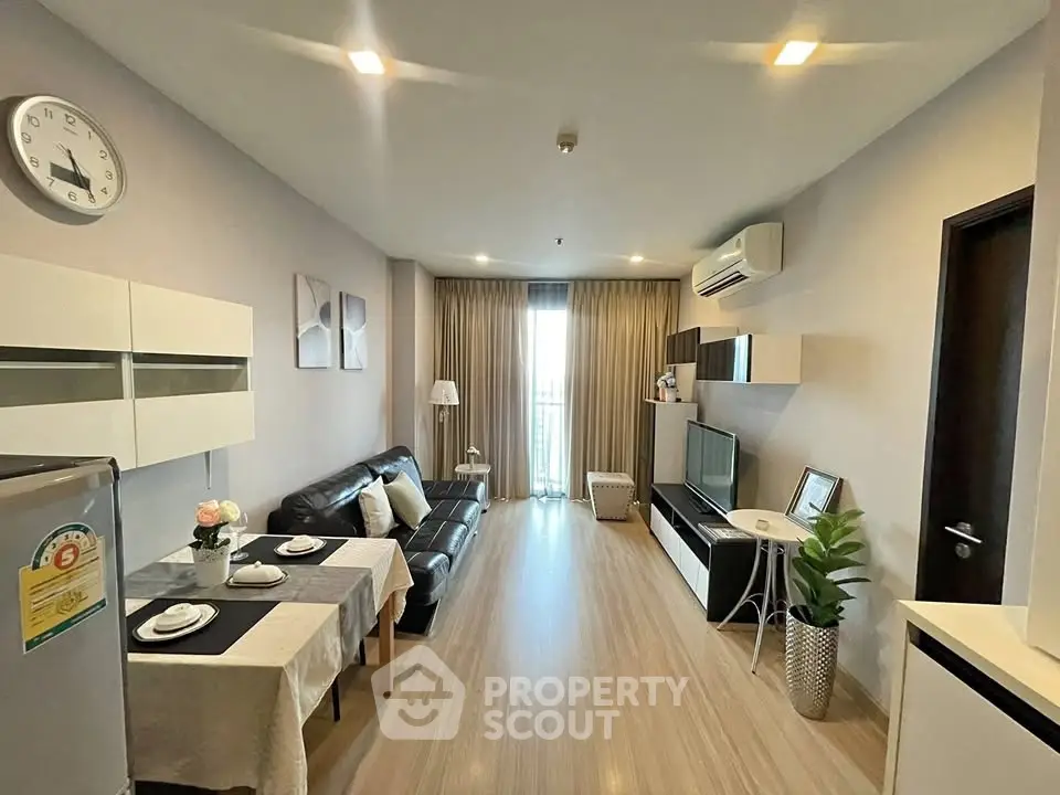 Modern living room with sleek furniture and natural light, perfect for urban living.