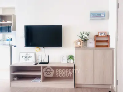 Modern living room with wall-mounted TV and stylish wooden furniture, perfect for cozy family gatherings.