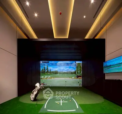 Luxurious indoor golf simulator room with modern lighting and sleek design