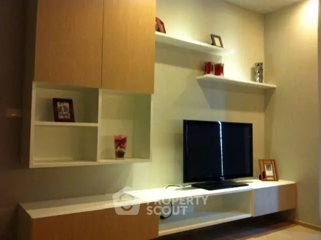 Modern living room with sleek TV unit and stylish shelving