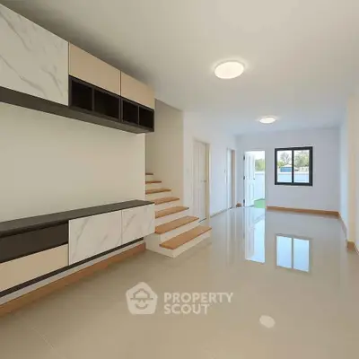 Spacious modern living room with sleek storage and natural light