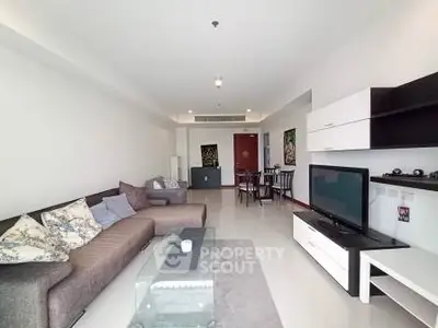 Spacious modern living room with stylish furniture and open layout in a contemporary apartment.