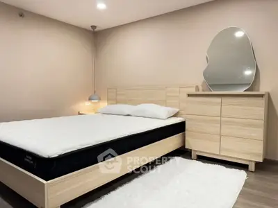 Modern bedroom with stylish wooden furniture and unique mirror design