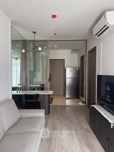 Modern living room with sleek design and open kitchen layout