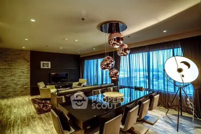 Luxurious modern living room with stylish lighting and panoramic city view.