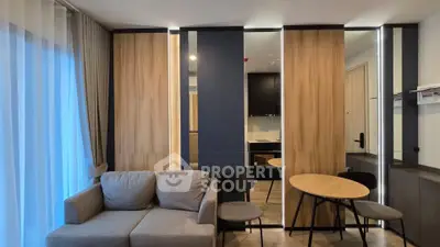 Modern living room with stylish furniture and wooden accents in a cozy apartment.