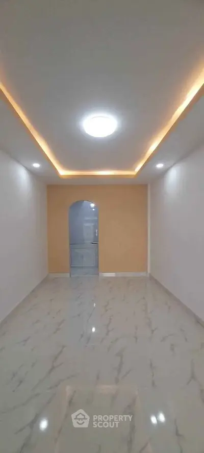 Modern interior with marble flooring and recessed lighting