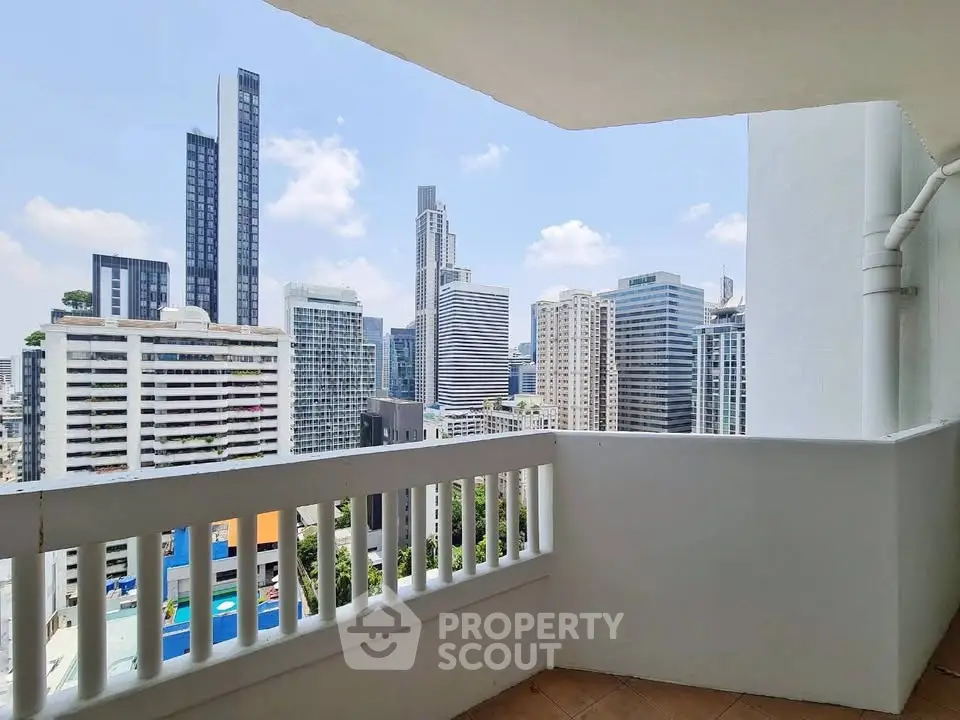 Stunning cityscape view from a high-rise balcony in a modern urban setting.