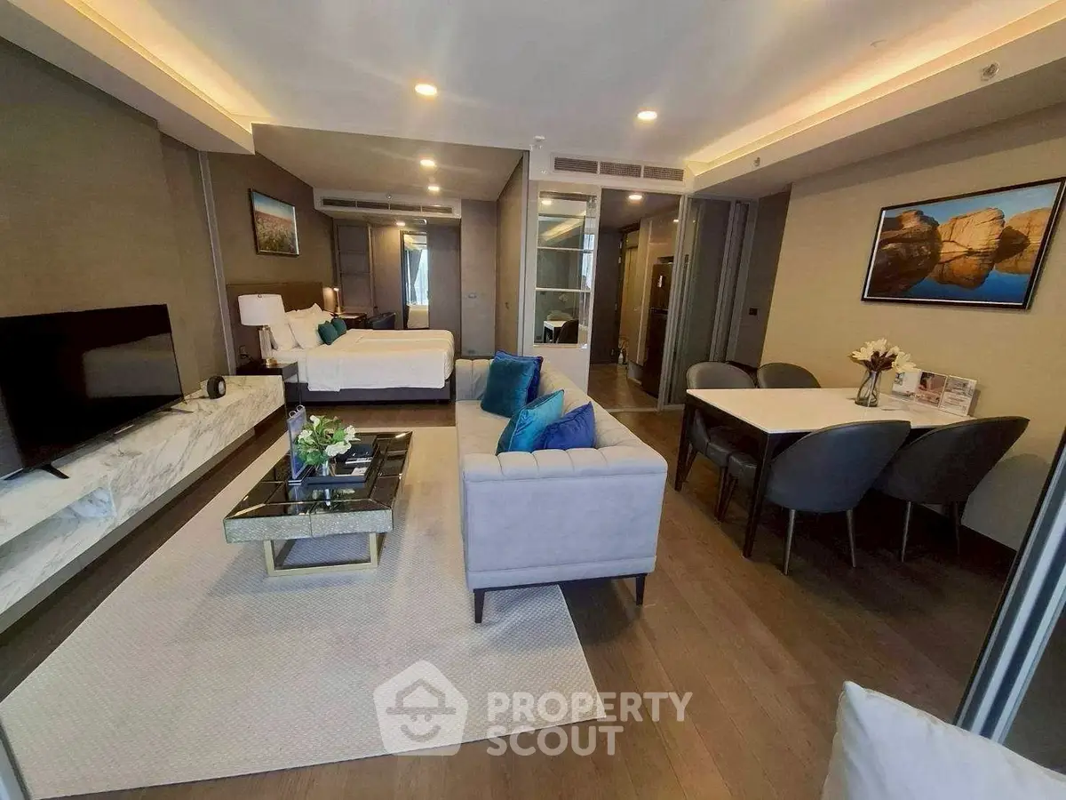 Luxurious open-plan living room with modern decor and elegant dining area