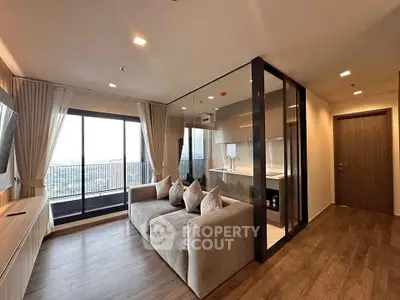 Modern living room with glass partition and balcony view in luxury apartment