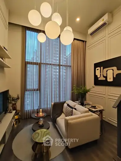 Elegant living room with high ceiling and modern decor