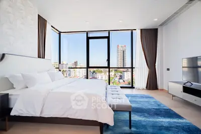 Luxurious bedroom with stunning city view and modern decor